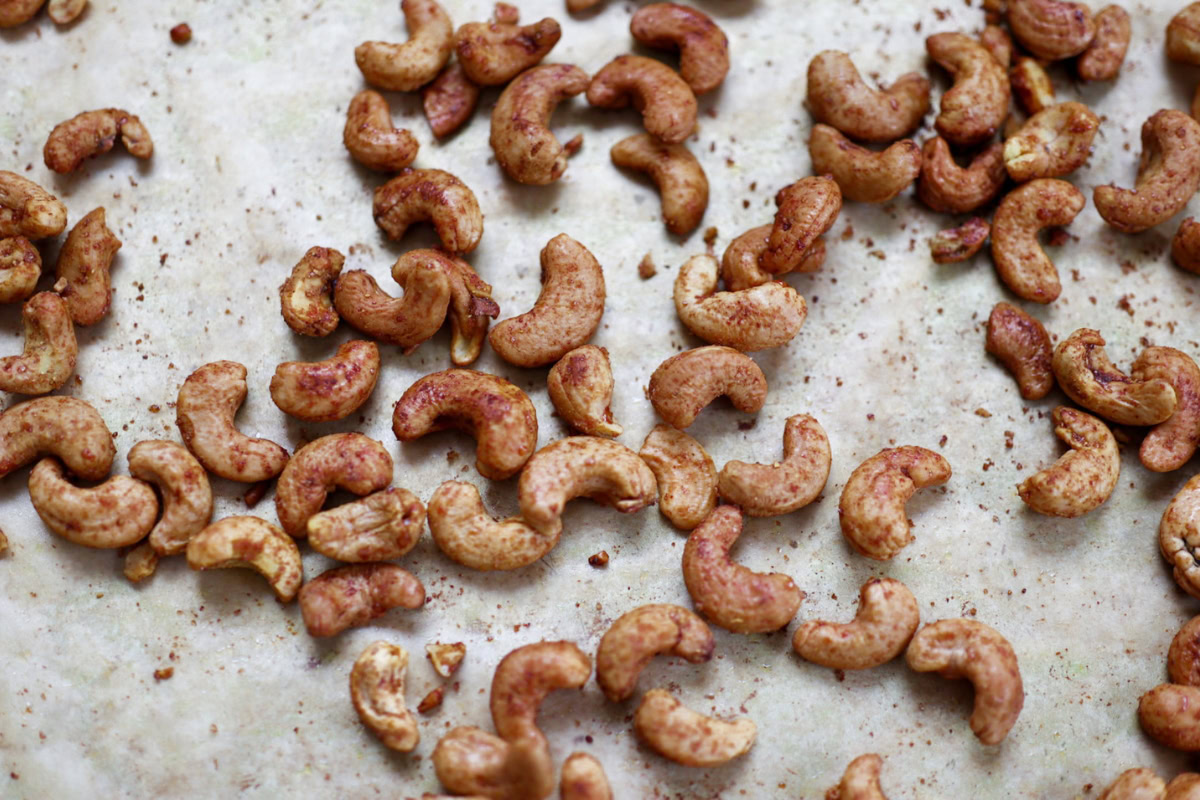 curry lime cashews on a baking sheet