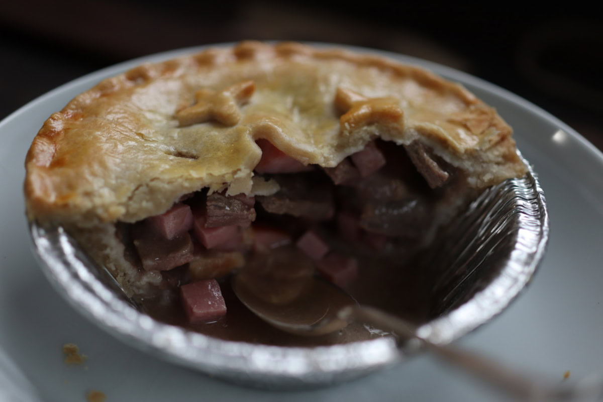 a partly eaten pot pie